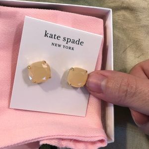 Pink/peach Kate spade earrings.